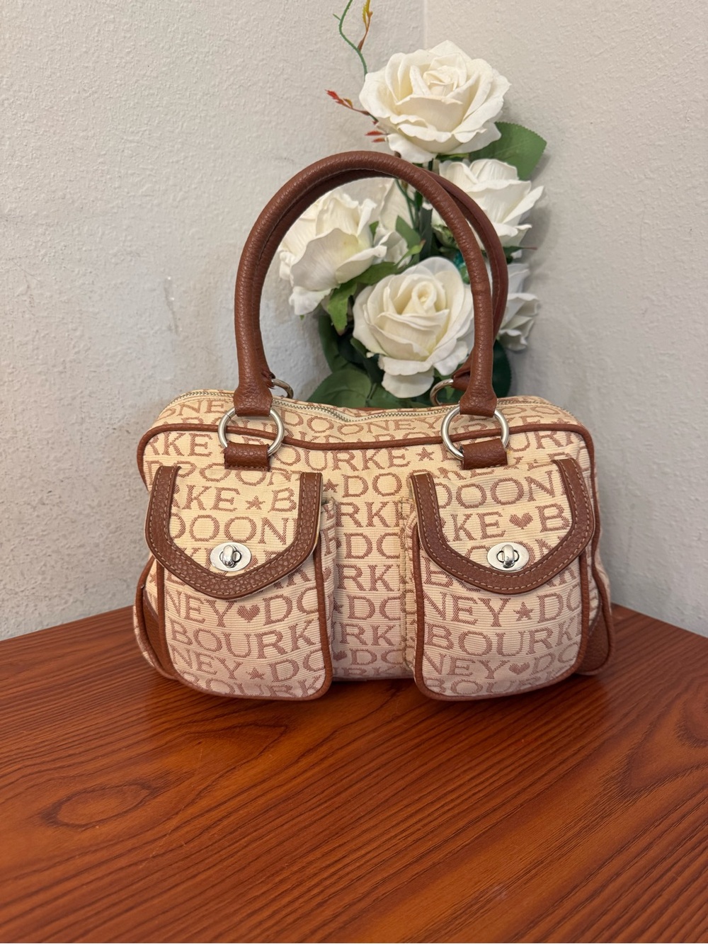 Dooney & Bourke Beige Logo Canvas Satchel with Brown Trim and Dual Front Pockets